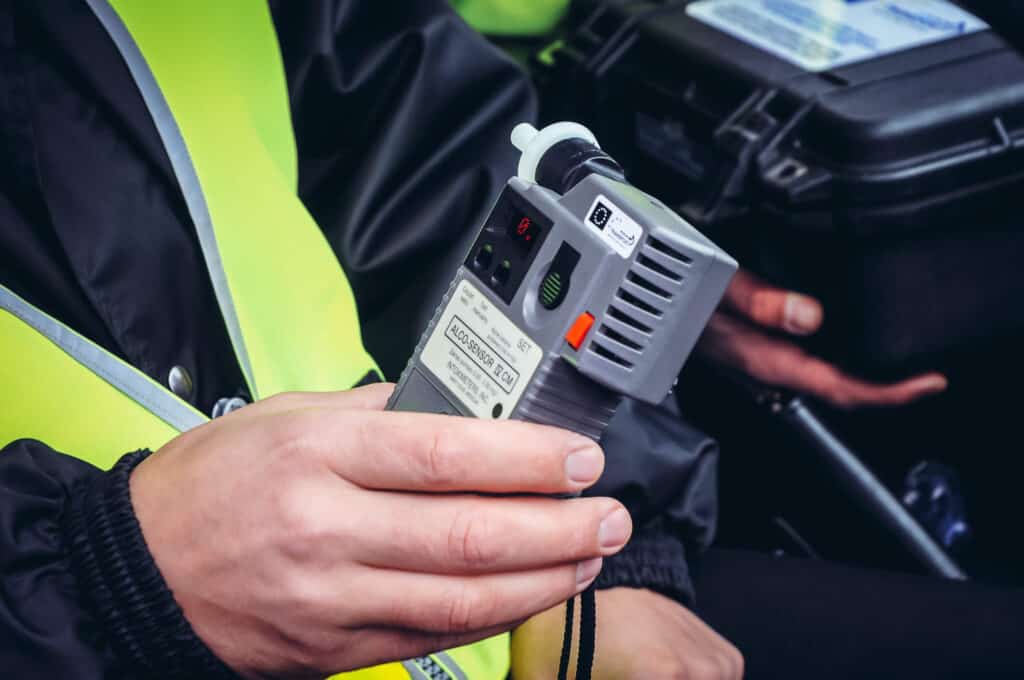 A police officer in Las Vegas Nevada conducting the HGN eye test on a driver suspected of DUI with legal insight from Lipp Law LLC