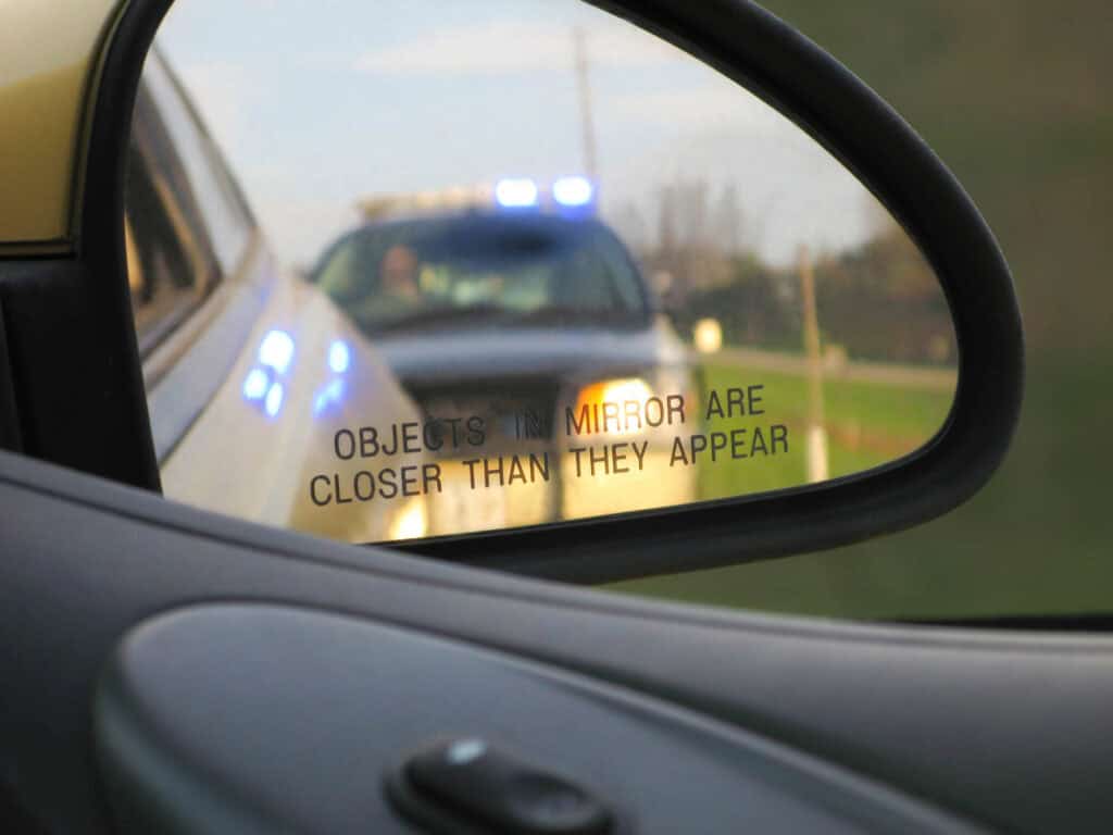 A police officer speaking to a driver through the window during a traffic stop in Las Vegas NV with guidance from Lipp Law LLC