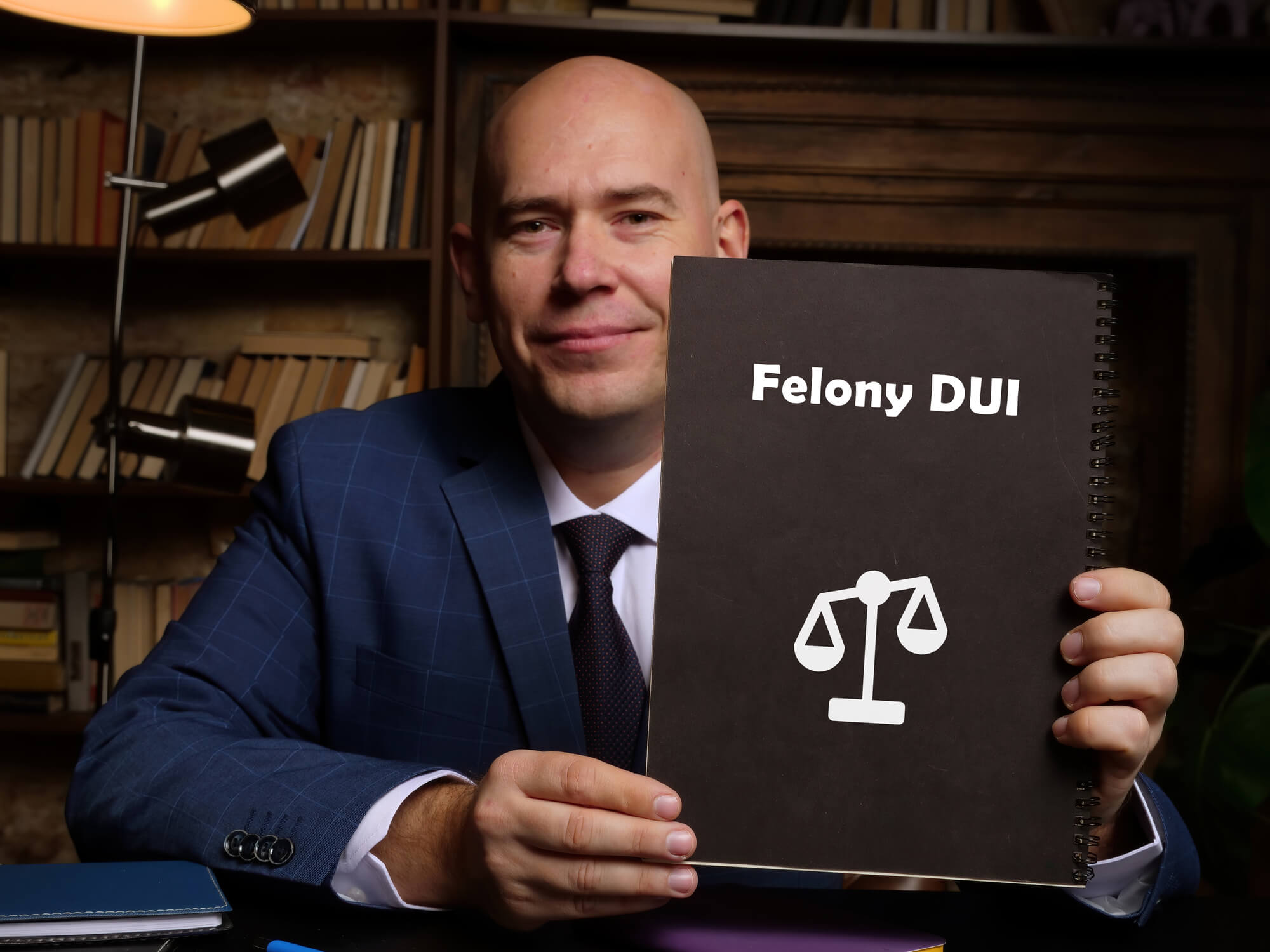 A legal gavel resting on a wooden desk next to a law book about felony DUI charges in Las Vegas Nevada for Lipp Law LLC.